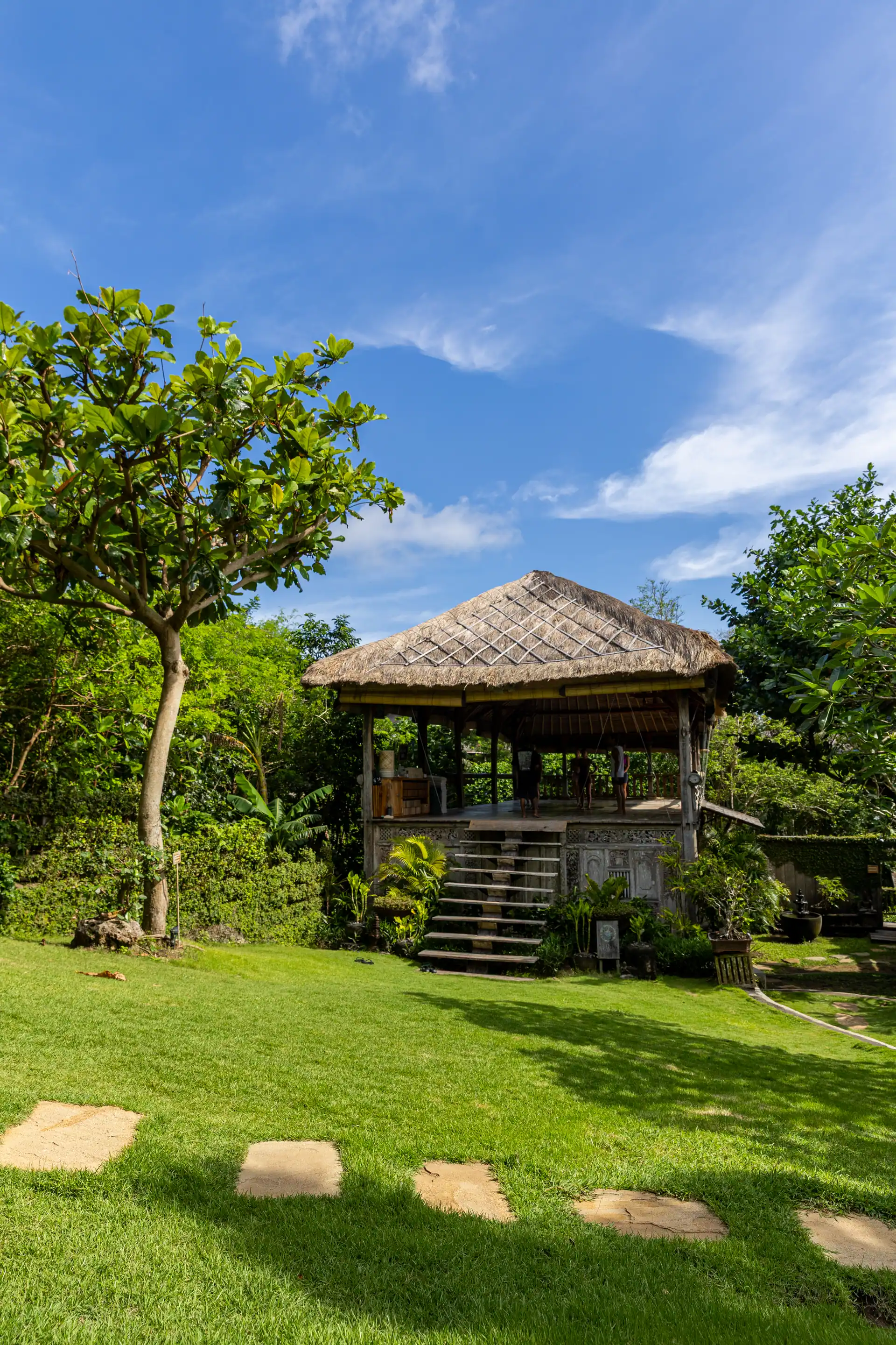 A thatched-roof yoga shala rising out of the Balinese jungle